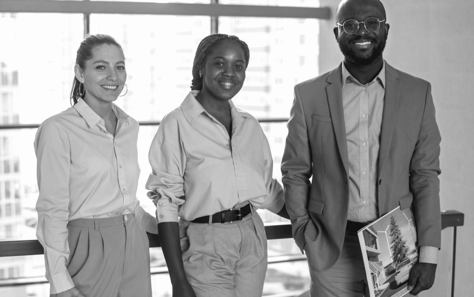 Professional finance team collaborating on automation strategies in modern office environment