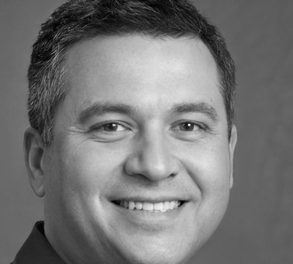 Professional portrait of Braxto Kellingham in business attire